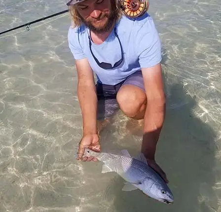 capt. craig clopper with lower keys redfish